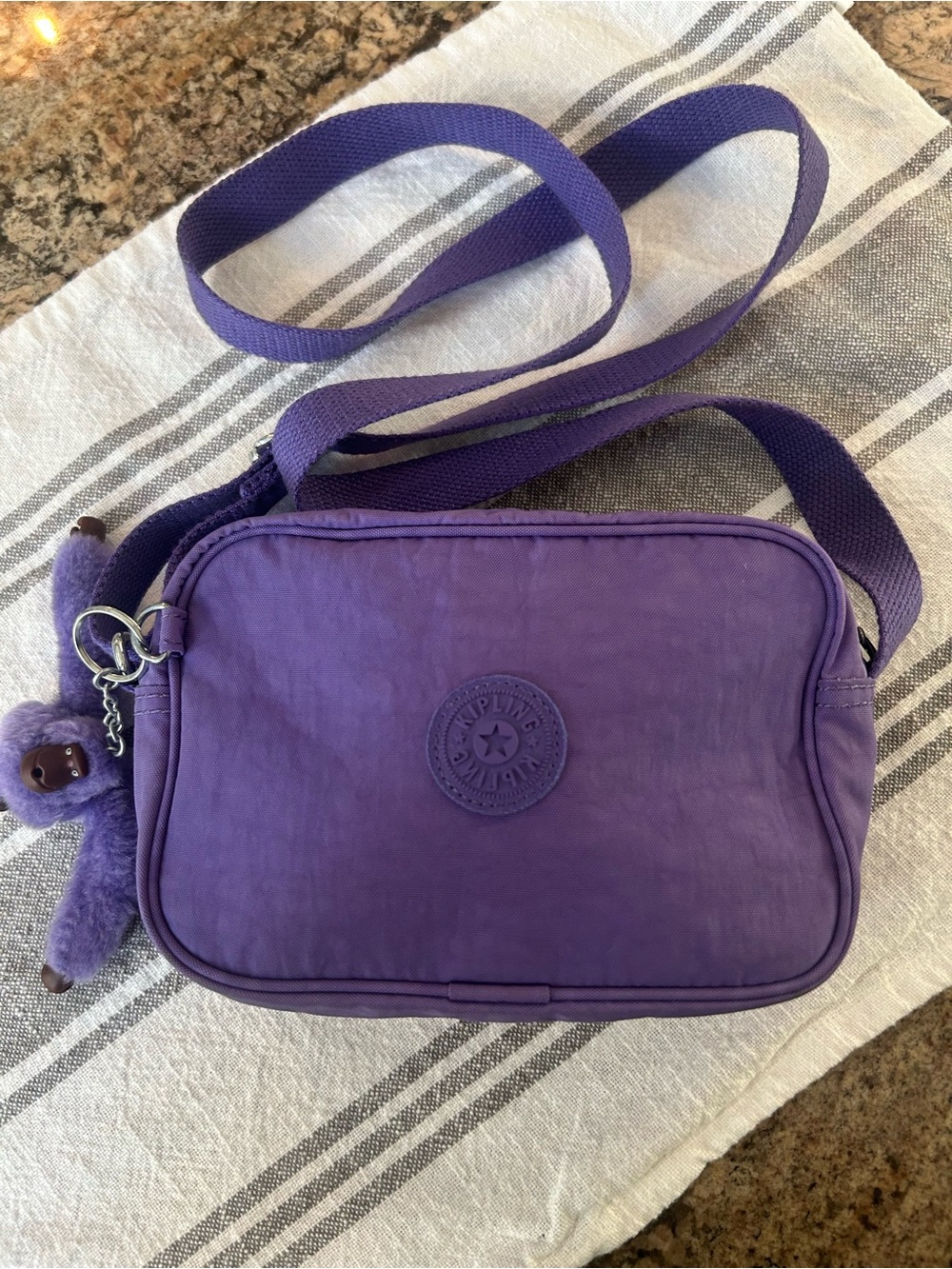 Kipling Vibrant Purple Crossbody with Signature Monkey Charm, almost new euc